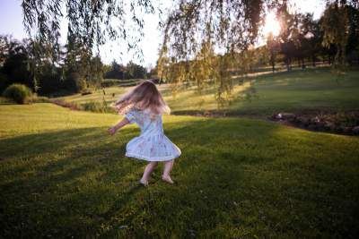 Girl playing on the grass