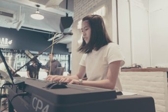 music school singapore piano teacher with students