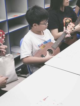 Music school singapore with students and family