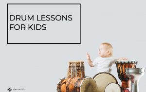 toddler playing the drums